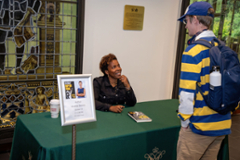 Prof Dennis talking to a student