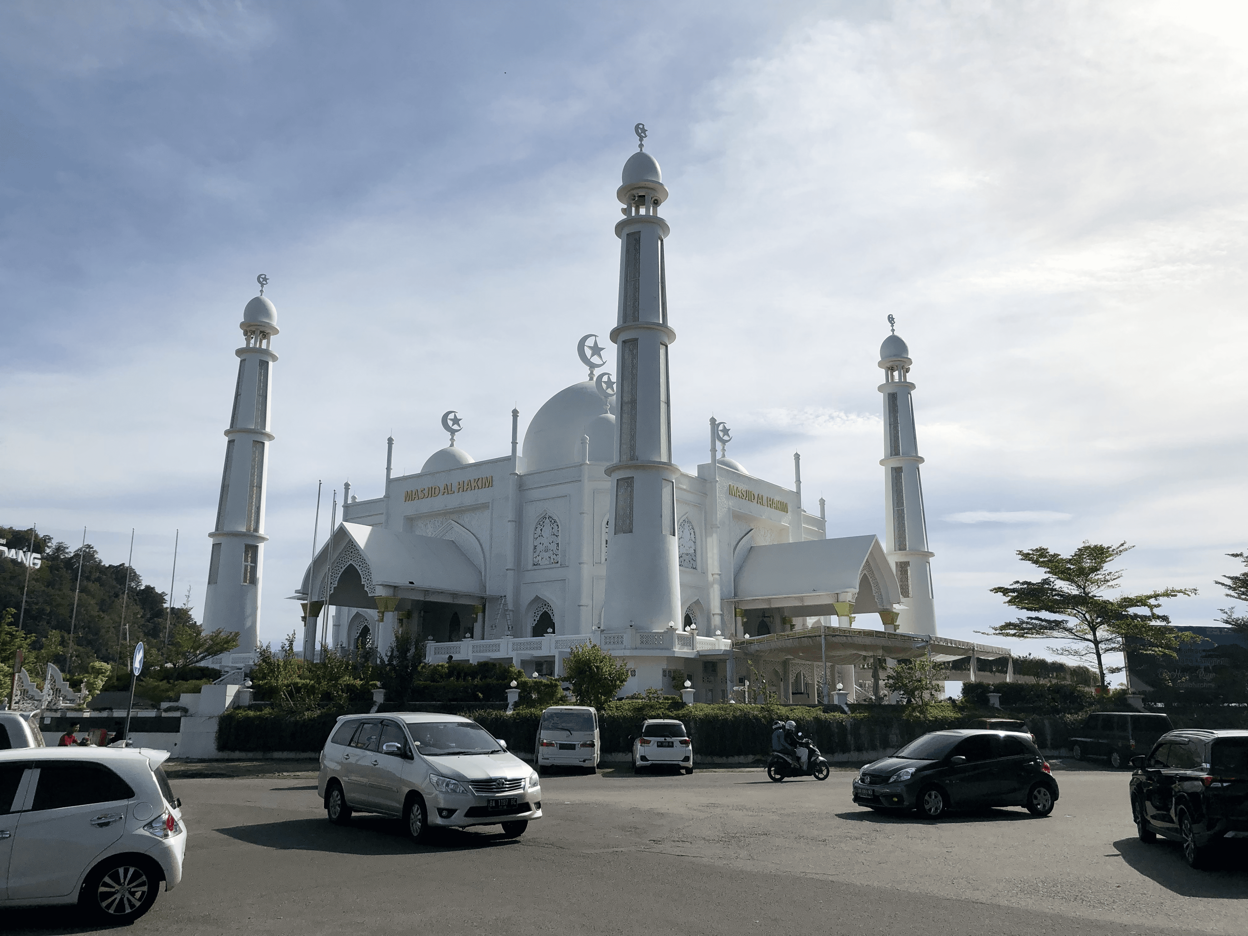 Masjid Al-Hakim, a relatively new mosque in Padang, overlooks the beach and a major tourist, business, and residential area.