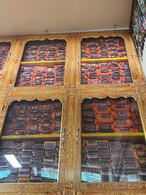 A bookshelf in His Holiness the Dalai Lama's temple