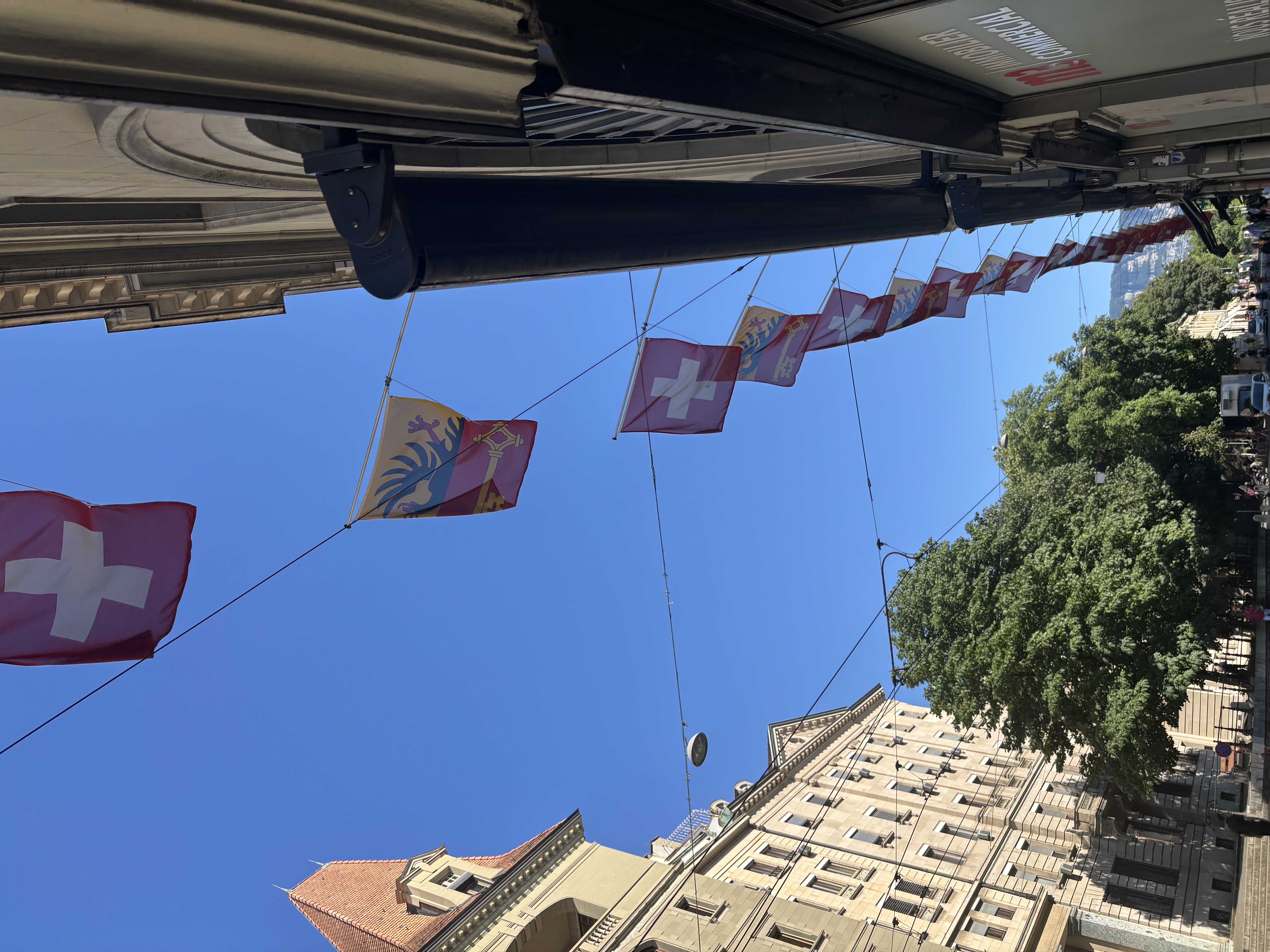 Street with Swiss and Geneva flags.