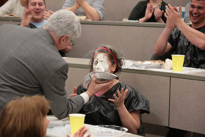 Dean Ende "pies" Fan Favorite Dean Howerton after the event. The pieing added $200 in bids to the money raised.