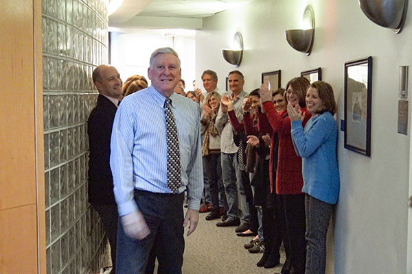 Professor Rosenberg's colleagues applaud him after his last class taught at William & Mary. 