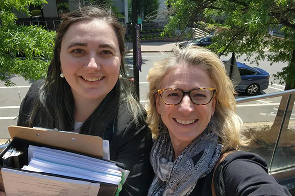 Melissa Box ’23 and Professor Kern-Scheerer at the Arlington Asylum Office for their client’s asylum interview in spring 2023.