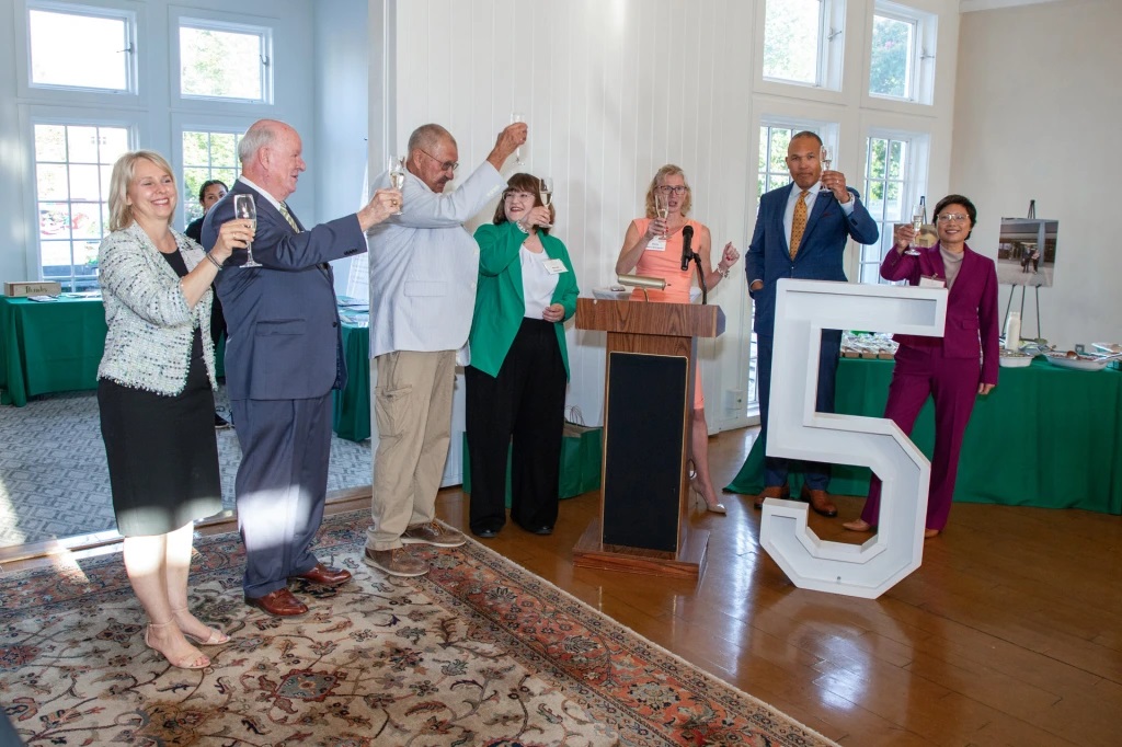 Clinic partners, staff, and guests of honor toast to the Clinic’s next five years. L-R: Christa Stewart, Immigrant Justice Corps; Peter Ganser, retired Foreign Service Officer and Diplomat; Paul Wickham Schmidt, retired Immigration Judge; Professor Nicole Medved; Professor and Clinic Director Stacy Kern-Scheerer; Dean A. Benjamin Spencer; Radlyn Mendoza, co-founder of Gardner & Mendoza, PC.