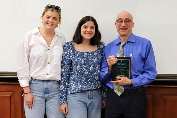 Professor Kades received his award from students Mary Catherine High '25 and Sophie Tully '26 while teaching Property Law. Photo by David F. Morrill