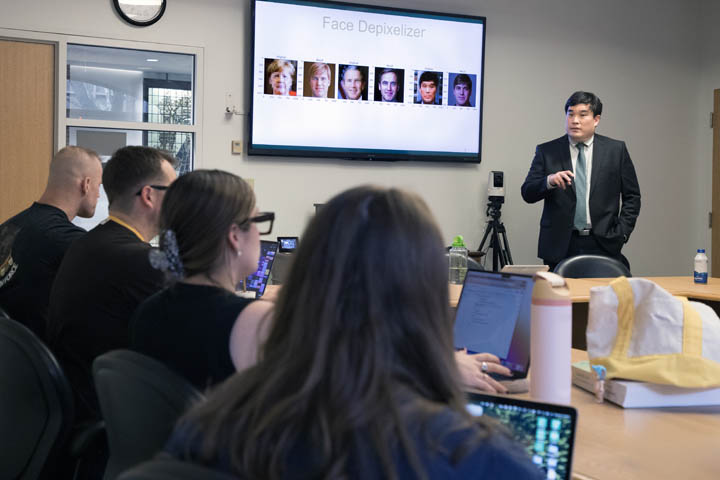 Professor Daniel Shin, Cyber Security Researcher in the Center for Legal & Court Technology, helps students detect deepfake photos and videos in a course on "AI: An Introduction for Non-Experts."