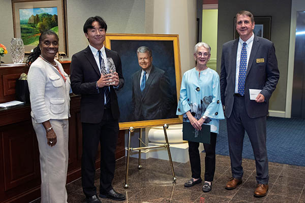 Alexis Swann MBA ’93, President at TowneBank; Benjamin Fu BBA ’26; Betsy Calvo Anderson B.A. ’70, HON ’15, P ’00; and Todd Mooradian, Dean of the Mason School of Business.