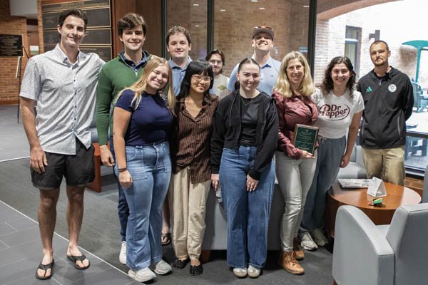 On May 6 students from the class surprised Professor Combs with the award. 